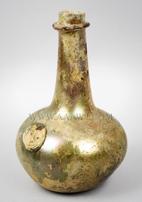 Blown Wine Bottle, Shaft and Globe, Dragon's Head Seal, Gold Iridescence
England
Circa 1660, entire view